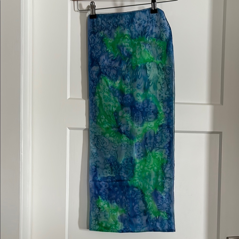 Vibrant blue and green tie-dye silk scarf.  SiZe 12” x 58” Great for color pop!